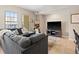 Comfortable living room with large gray sectional couch and views of the city at 975 N Lincoln St # 4F, Denver, CO 80203