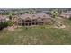Aerial view of a large home with multiple balconies, a spacious yard, and scenic views of the surrounding landscape at 6963 S Espana Way, Centennial, CO 80016