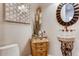 Charming powder room with a unique vessel sink, decorative mirror, and stylish decor at 6963 S Espana Way, Centennial, CO 80016