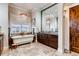 Luxurious bathroom featuring a soaking tub, elegant fixtures, and designer finishes at 6963 S Espana Way, Centennial, CO 80016