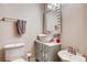 Chic bathroom featuring a vessel sink, modern vanity, large mirror, and stylish fixtures at 6963 S Espana Way, Centennial, CO 80016
