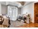 Bright and airy bedroom with decorative pillows and a unique bedside table at 6963 S Espana Way, Centennial, CO 80016