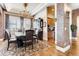 Charming dining room with hardwood floors, elegant chandelier, and china cabinet at 6963 S Espana Way, Centennial, CO 80016