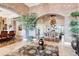 Elegant foyer with brick archway, travertine flooring, and stylish decor at 6963 S Espana Way, Centennial, CO 80016