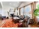 Inviting living room featuring a cozy fireplace, plush seating, and ample natural light at 6963 S Espana Way, Centennial, CO 80016
