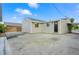 Backyard features siding of home, concrete patio, rock area, and space for relaxing and entertaining at 5541 E 65Th Ave, Commerce City, CO 80022