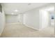 Open basement boasts neutral tones, carpet, closet, and natural light for versatile living at 5541 E 65Th Ave, Commerce City, CO 80022