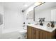 Contemporary bathroom with a tub-shower combo, and stylish fixtures at 5541 E 65Th Ave, Commerce City, CO 80022