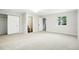 Spacious bedroom with new carpet, a large window, and ensuite bath at 5541 E 65Th Ave, Commerce City, CO 80022