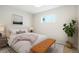 Cozy bedroom with soft lighting, comfortable bedding, and decorative accents at 5541 E 65Th Ave, Commerce City, CO 80022