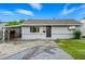 Charming single-story home with a cozy carport and manicured lawn at 5541 E 65Th Ave, Commerce City, CO 80022