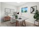 Bright office space featuring a modern desk, stylish decor, and a large window at 5541 E 65Th Ave, Commerce City, CO 80022