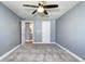 This simple yet comfortable bedroom features plush carpeting and a ceiling fan at 1125 N Washington St # 303, Denver, CO 80203