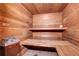 Relax in the building's sauna, featuring wood benches and a heater at 1125 N Washington St # 303, Denver, CO 80203