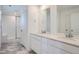 Bathroom boasts double vanity sinks, granite countertops, and a tiled walk-in shower at 2090 S Haleyville Way, Aurora, CO 80018