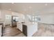Modern kitchen featuring stainless steel appliances, white cabinets, and an island with sink at 2090 S Haleyville Way, Aurora, CO 80018