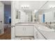 Bright bathroom with double sinks, large mirrors, and modern fixtures at 19019 E Warren Dr # H104, Aurora, CO 80013