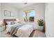 Cozy bedroom enhanced with calming decor elements and sun-filled window providing natural light at 19019 E Warren Dr # H104, Aurora, CO 80013