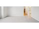 Spacious bedroom featuring neutral carpeting and a view of the hallway at 19019 E Warren Dr # H104, Aurora, CO 80013