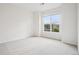 A bright bedroom with a large window offering great natural light at 19019 E Warren Dr # H104, Aurora, CO 80013