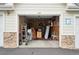 Open garage with natural lighting and storage solutions for organization at 19019 E Warren Dr # H104, Aurora, CO 80013