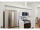 Kitchen view of stainless-steel appliances, modern cabinetry, and quartz countertops at 19019 E Warren Dr # H104, Aurora, CO 80013