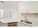 Bright kitchen features stainless steel appliances, modern cabinetry, and a light countertop at 19019 E Warren Dr # H104, Aurora, CO 80013