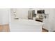Modern kitchen with stainless steel appliances, quartz countertops, and ample storage at 19019 E Warren Dr # H104, Aurora, CO 80013