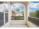 Open-air front patio showing views of the neighborhood with natural lighting at 19019 E Warren Dr # H104, Aurora, CO 80013