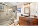 Chic bathroom featuring a glass enclosed shower, granite counters, and modern fixtures at 28454 Meadow Dr, Evergreen, CO 80439