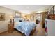 Comfortable bedroom featuring soft lighting, wood accents, and a calming atmosphere at 28454 Meadow Dr, Evergreen, CO 80439