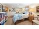Cozy bedroom with neutral tones, a comfortable bed, and ample natural light at 28454 Meadow Dr, Evergreen, CO 80439