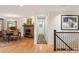 Elegant dining room with stone fireplace, chandelier, and hardwood floors, perfect for formal gatherings at 28454 Meadow Dr, Evergreen, CO 80439