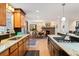 Spacious kitchen with stone countertops, stainless steel appliances, and an adjacent dining area with a fireplace at 28454 Meadow Dr, Evergreen, CO 80439