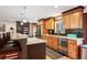 Stylish kitchen with granite countertops, stainless steel appliances, a breakfast bar, and modern cabinetry at 28454 Meadow Dr, Evergreen, CO 80439
