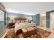Cozy primary bedroom features a comfortable bed, stylish rug, and ensuite bathroom at 28454 Meadow Dr, Evergreen, CO 80439