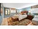Comfortable primary bedroom is brightly lit with stylish decor at 28454 Meadow Dr, Evergreen, CO 80439