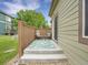 Back patio includes an outdoor rug, seating, and a small side table for outdoor leisure at 4501 S Tabor Ct, Morrison, CO 80465