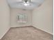 Comfortable bedroom with a ceiling fan and a large window, allowing for natural light at 4501 S Tabor Ct, Morrison, CO 80465