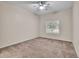 Inviting bedroom featuring a ceiling fan and a window with adjustable shutters, enhancing comfort at 4501 S Tabor Ct, Morrison, CO 80465
