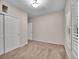 Neutral carpeted bedroom with natural lighting, double door closet, and neutral paint at 4501 S Tabor Ct, Morrison, CO 80465