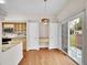 Bright dining area with a pendant light fixture and sliding glass doors leading to a backyard at 4501 S Tabor Ct, Morrison, CO 80465