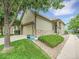 Charming single-Gathering home with stone accents, a manicured lawn, and attached garage at 4501 S Tabor Ct, Morrison, CO 80465