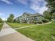 Charming multi-Gathering building featuring balconies, lush lawn, and inviting walkway at 4501 S Tabor Ct, Morrison, CO 80465