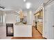Modern kitchen features stainless steel appliances, light wood cabinets, and granite countertops at 4501 S Tabor Ct, Morrison, CO 80465