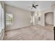 Inviting living room with neutral tones, a ceiling fan, and multiple windows at 4501 S Tabor Ct, Morrison, CO 80465