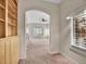 Open concept living room with a large window and archway and a built in book shelf at 4501 S Tabor Ct, Morrison, CO 80465
