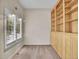Office with built-in bookshelves and a window with plantation shutters for natural light at 4501 S Tabor Ct, Morrison, CO 80465