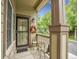 Cozy front porch with a seating area, decorative wreath, and view of the neighborhood at 4501 S Tabor Ct, Morrison, CO 80465