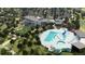 Aerial view of community park and recreation center with pool, play area, and greenspace at 131 S Vandriver Way, Aurora, CO 80018